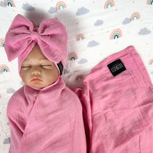 Load image into Gallery viewer, Solid baby pink muslin organic cotton swaddles styled by mommy and me arabia
