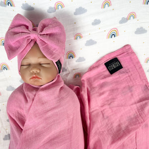 Solid baby pink muslin organic cotton swaddles styled by mommy and me arabia