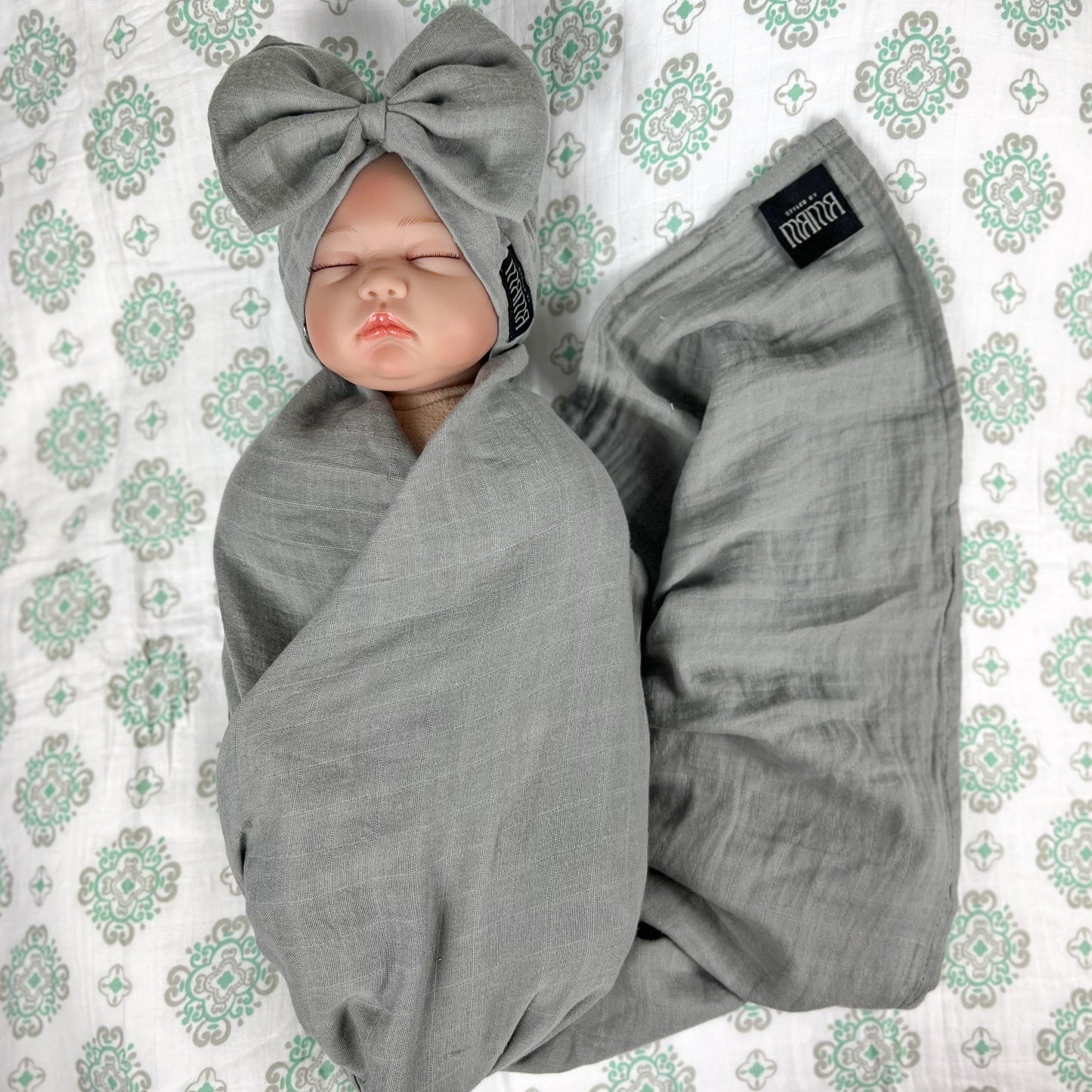 Solid moss grey muslin organic cotton swaddles styled by mommy and me arabia