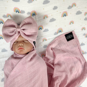 Solid rustic pink muslin organic cotton swaddles styled by mommy and me arabia