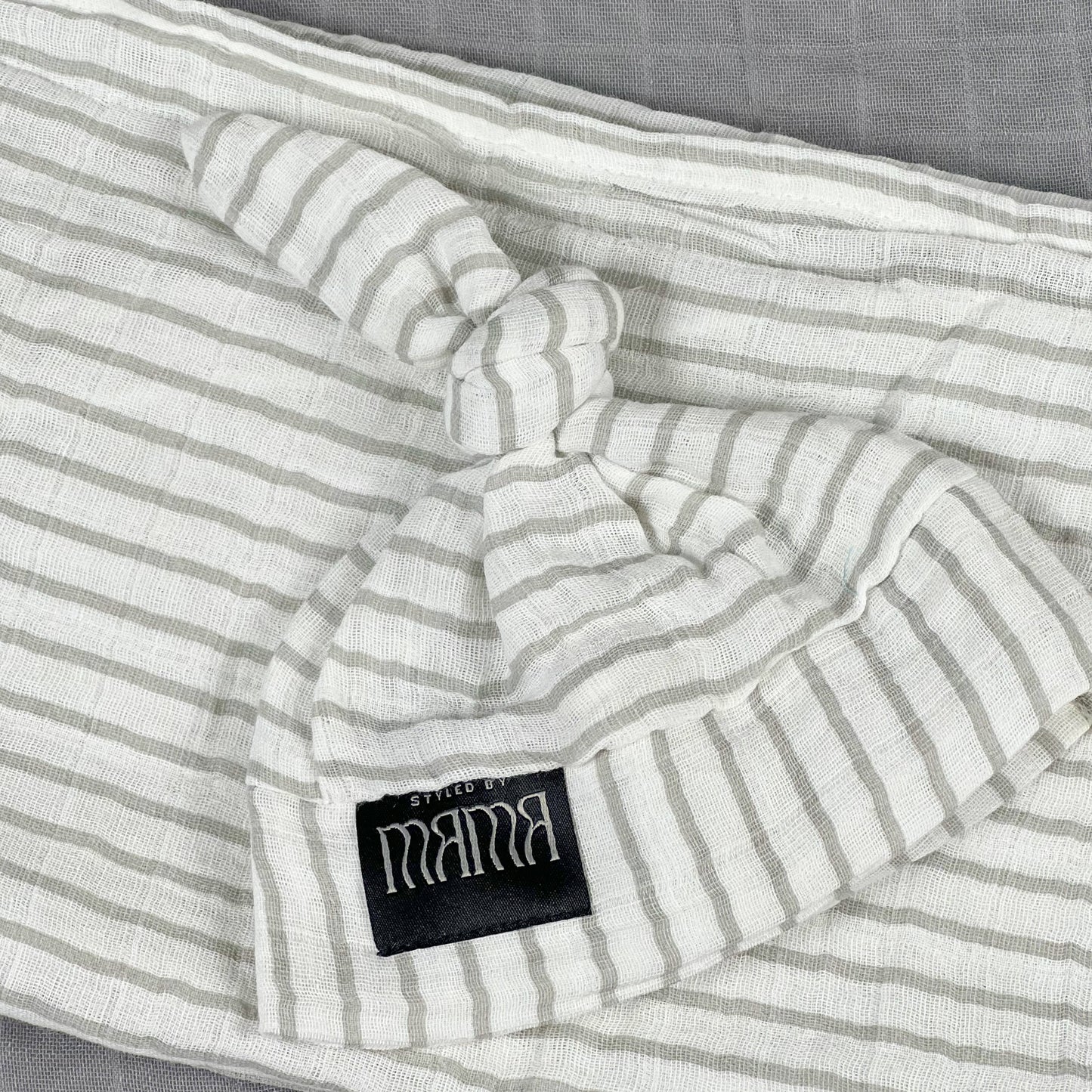 Grey stripes Muslin organic cotton swaddles styled by mommy and me arabia