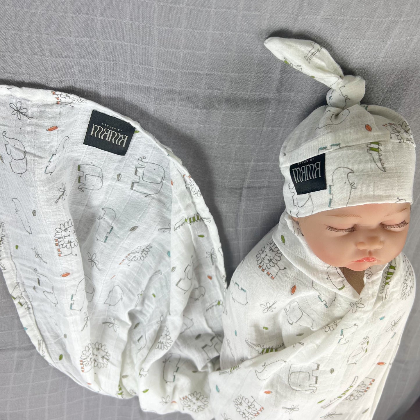 Wild world Muslin organic cotton swaddles styled by mommy and me arabia