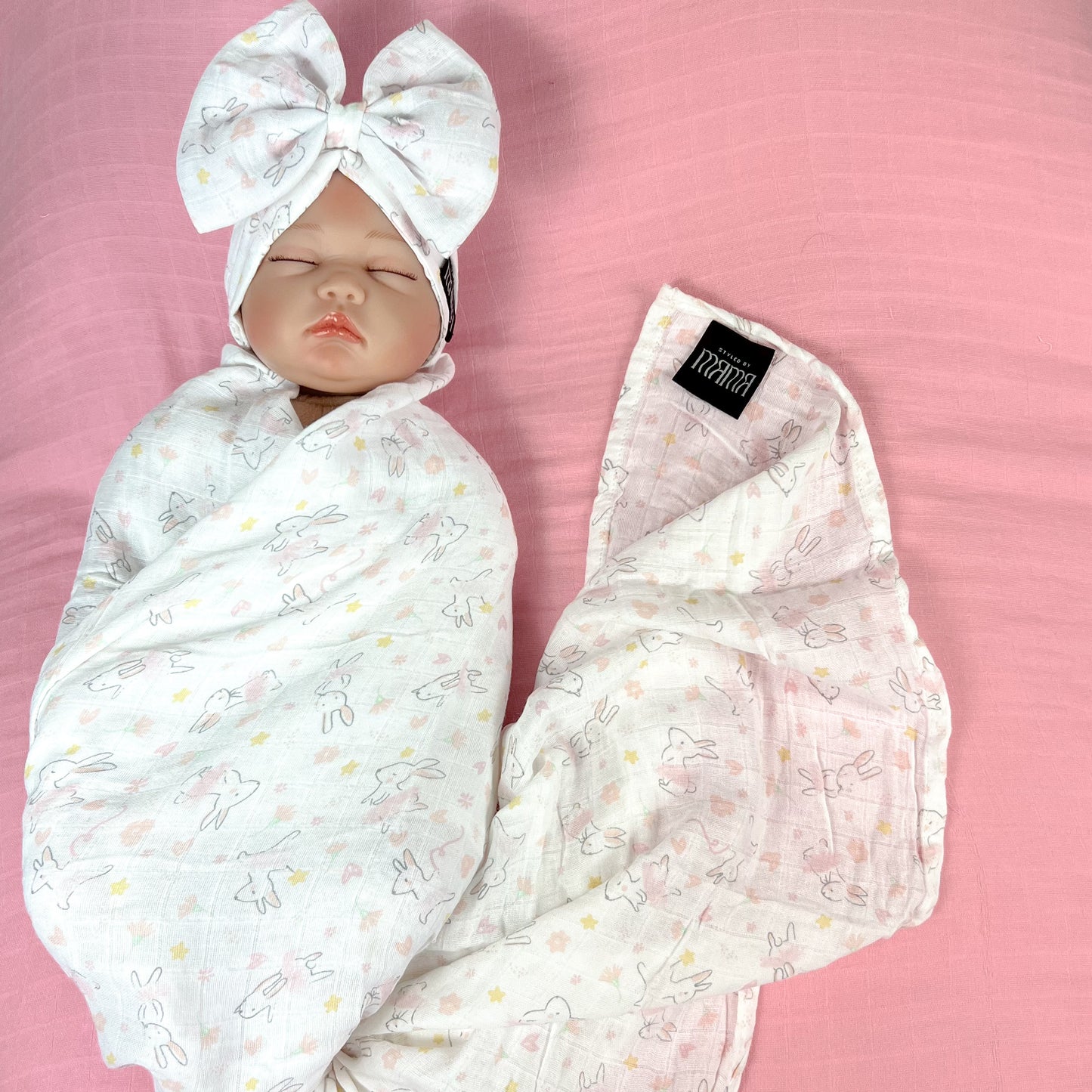 Happy bunny pink printed Muslin organic cotton swaddles styled by mommy and me arabia