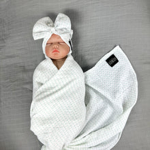 Load image into Gallery viewer, Green polka dots printed Muslin organic cotton swaddles styled by mommy and me arabia
