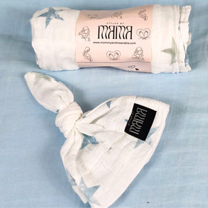 Baby blue stars print muslin organic cotton swaddles styled by mommy and me Arabia