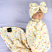 Load image into Gallery viewer, Yellow stars muslin organic cotton swaddles styled by mommy and me arabia
