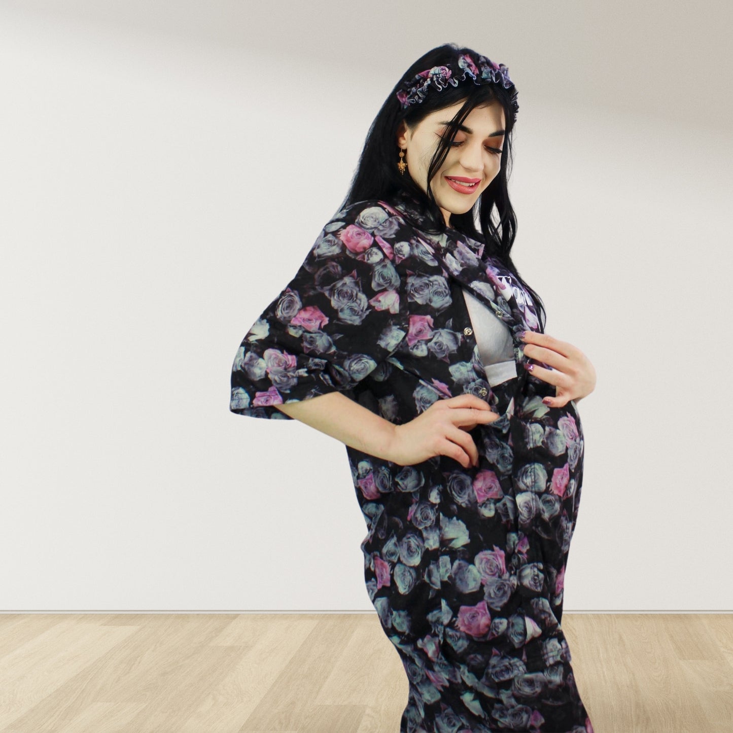 maternity nursing pajama set with baby romper breathable cottoN,mom and baby and wearing a matching pajama set with a floral pattern. The set includes a button-down top with drop shoulders and side buttons for breastfeeding, and matching romper for the baby.made in uae