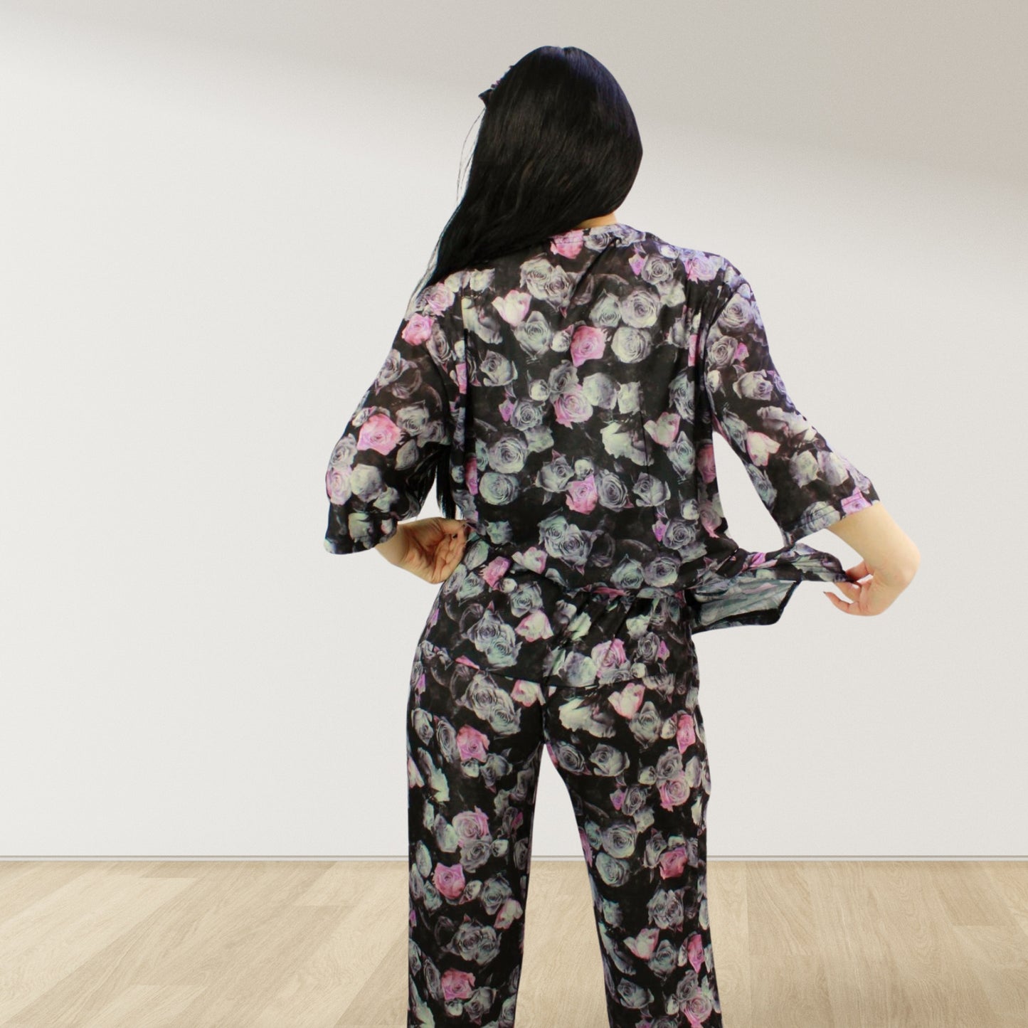 maternity nursing pajama set with baby romper breathable cottoN,mom and baby and wearing a matching pajama set with a floral pattern. The set includes a button-down top with drop shoulders and side buttons for breastfeeding, and matching romper for the baby.made in uae